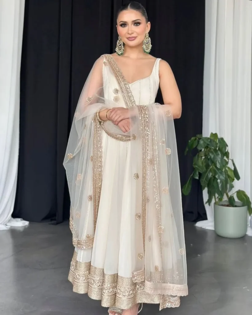 women wearing white party wear suit set